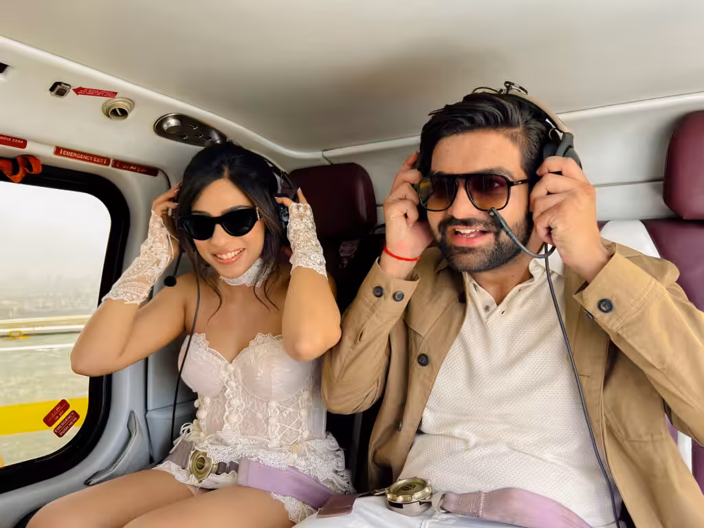 couple sitting in helicoptor enjoying air riding