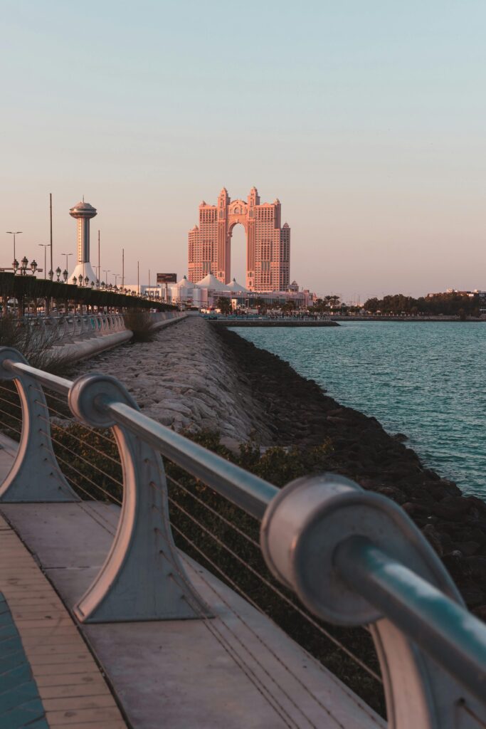 Captivating view of Abu Dhabi's iconic architecture during sunset by the waterfront.