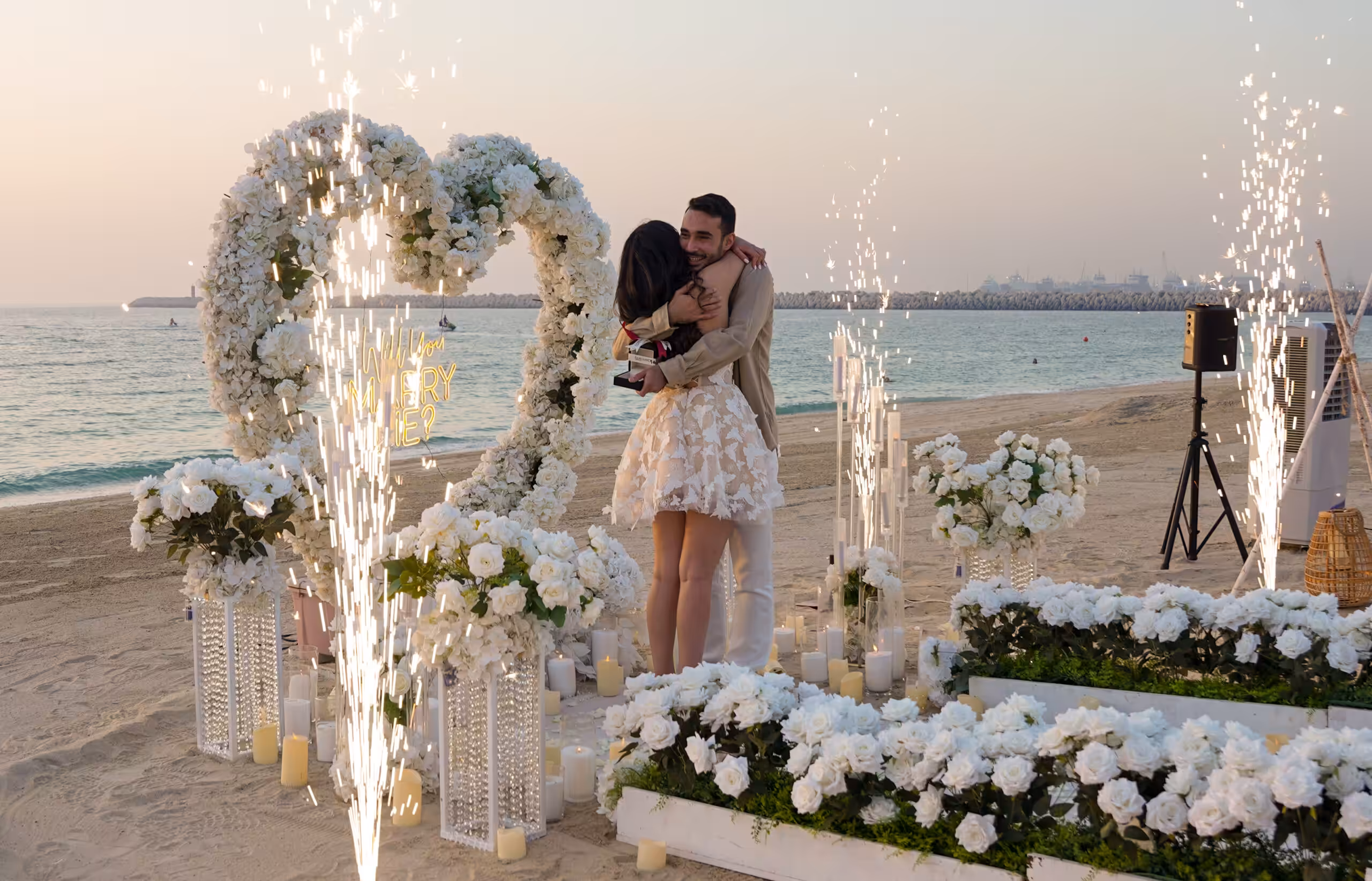 Luxury heart flower with fireworks frame at beach proposal in dubai