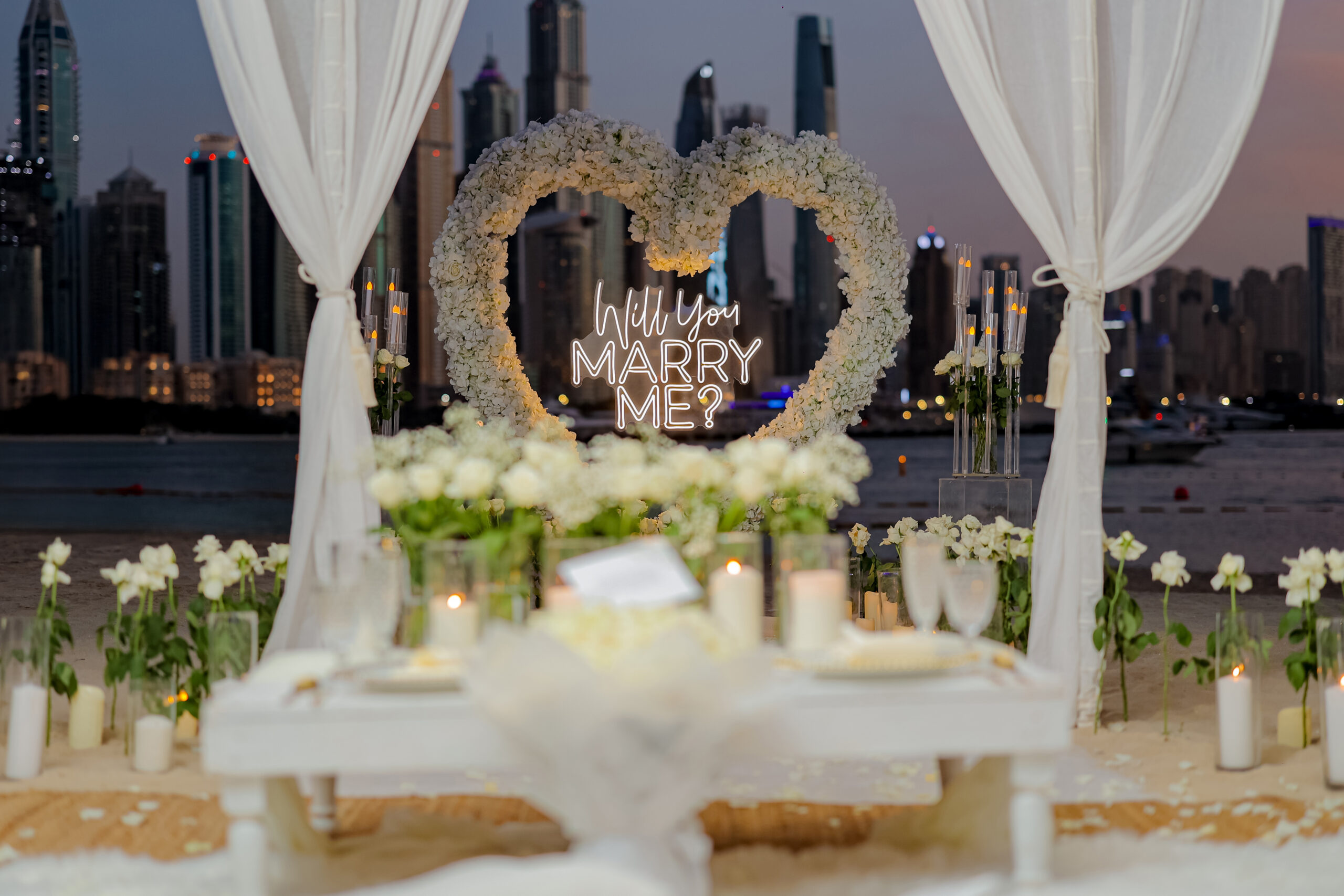 large frame with balloons, hilton the palm beach proposal dubai luxury tent heart frame marina skyline event marry me scaled